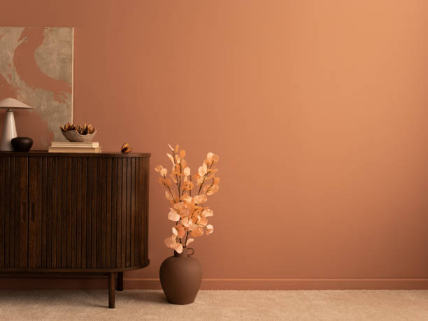 istock Modern composition of living rorrm interior with mock up poster frame, copy space, wooden sideboard, brown vase with flowers, books, sculpture, bowl and personal accessories. Home decor. Template. 1469948747
