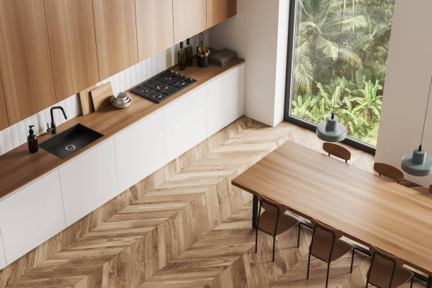 istock Top view of wooden kitchen interior with eating table and panoramic window 1469949283