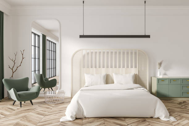istock Light bedroom interior with armchair and bed with dresser, panoramic window 1469949346