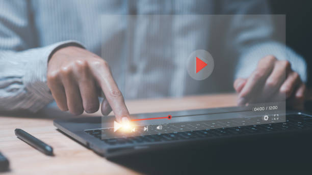 istock a man pointing at virtual reality icon,to watch videos via wireless technology,Training, learning, teaching,virtual reality used in online video conferencing,Online streaming Watch videos on Internet 1469952984