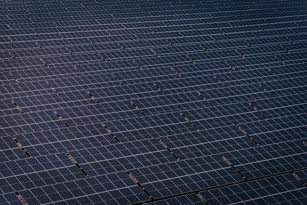 istock Solar panels large farm - aerial view 1469955118