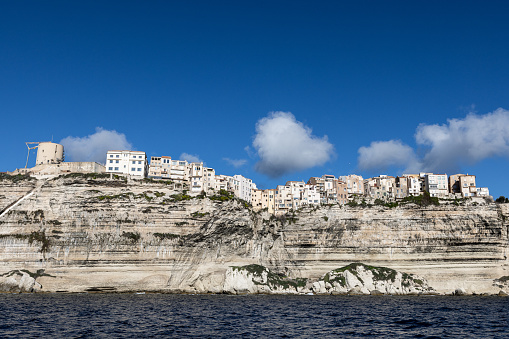 Famous for its upper town, Bonifacio is also known for its steep white limestone cliffs. Perched on a white cliff, the old town is protected by its citadel and dominates proudly the sea and the marina.