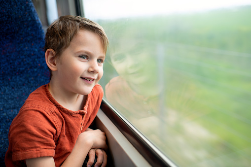Little boy enjoying travel by train