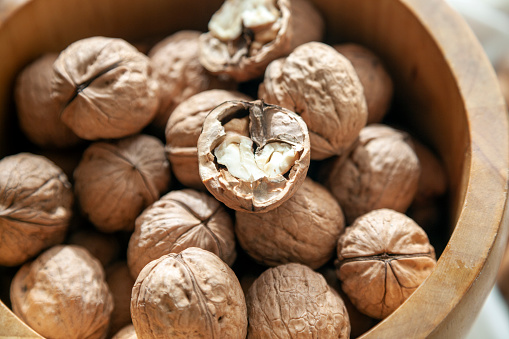 Ripe walnuts split and scattered ,high angle view