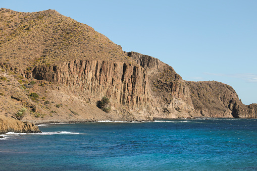 Beautiful cliffs and coves in Isleta del Moro village in Cabo de Gata, Almeria, Spain