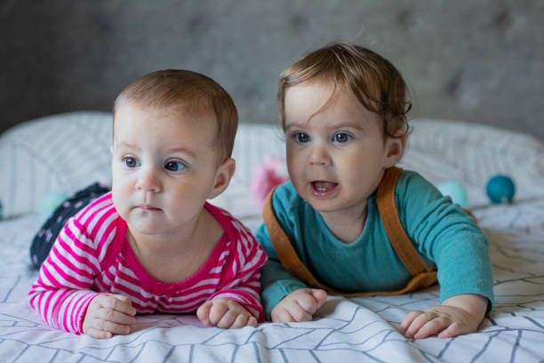 istock Twin babies brother and sister portrait 1469960846
