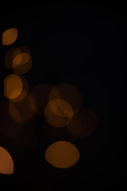 istock Golden glitter falling sparkle background on black with side copy space 1469961753