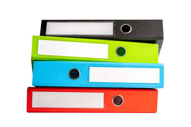 istock File Folder Binder stack of multi color on table in business office isolated on white background with clipping path. 1469961968