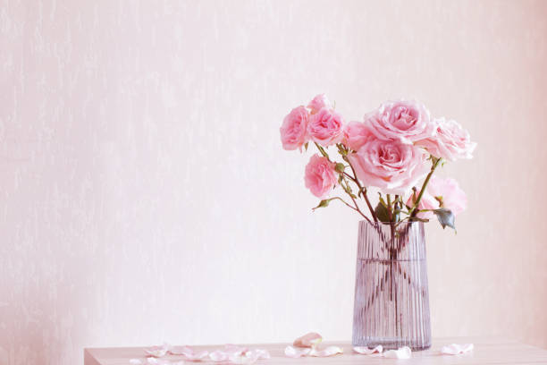 istock still life with pink roses in glass vase 1469962099