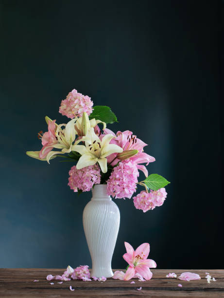 istock summer flowers in white vintage vase on dark background 1469962108