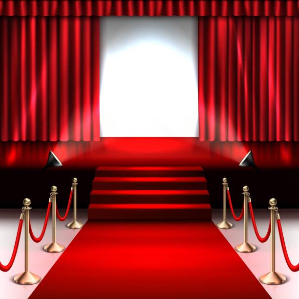 istock 3d realistic stage with red carpet and spotlight and gold barrier. 1469963377