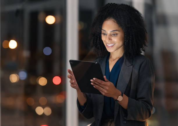 istock Night business, black woman and tablet for communication, marketing and data analytics online with smile for success, achievement and benchmarking results. Entrepreneur with technology for innovation 1469965662