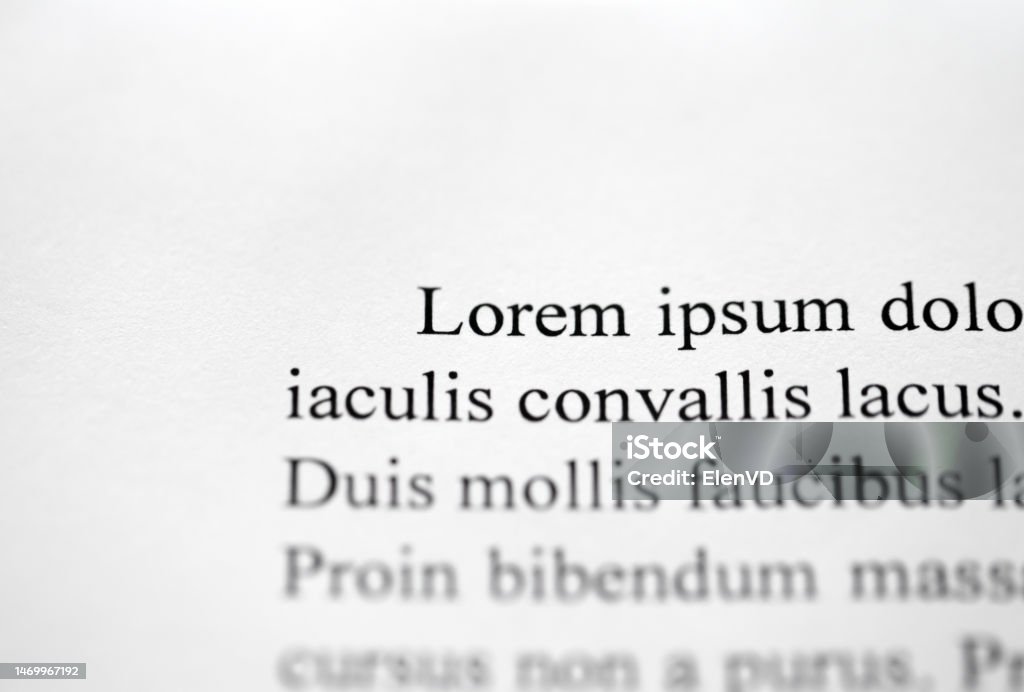 Lorem Ipsum on printed on paper, top view, sample document beginning of paragraph of text, selective focus Angle Stock Photo