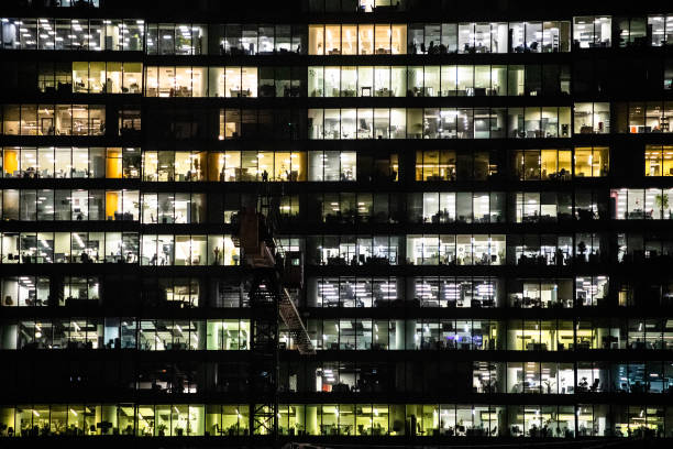 istock background with of illuminated offices in building 1469967478