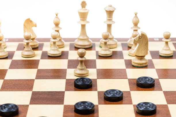 istock white chess and black checkers gaming on board 1469967497