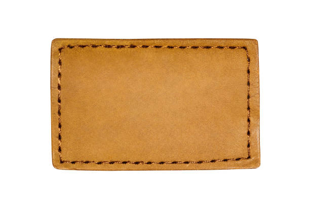 istock Square leather label brown from denim pants, empty space to copy text, isolated on white background with clipping path 1469968274