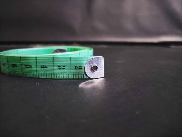 Green Tailors Tape Measure Stock Photo - Download Image Now - Accuracy,  Centimeter, Close-up - iStock