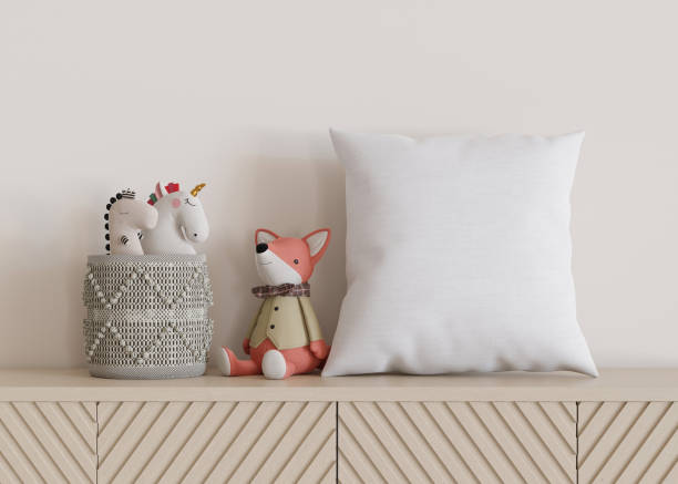istock White square pillow in kids room. Blank cushion case template for your graphic design presentation. Pillow cover mock up for print, pattern, personalized illustration. Close-up. 3D rendering. 1469968768