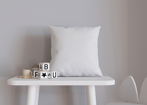 White square pillow in kids room. Blank cushion case template for your graphic design presentation. Pillow cover mock up for print, pattern, personalized illustration. Close-up. 3D rendering