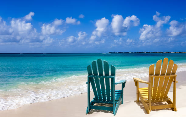 istock Two chairs on a white sand of Caribbean coast 1469969066