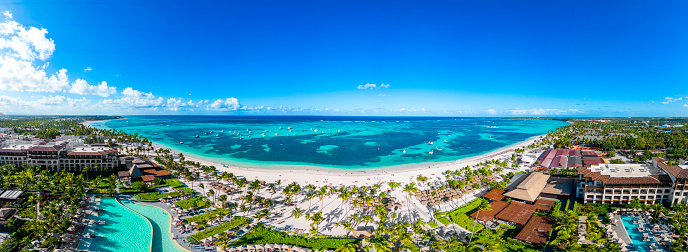 Panorama of the all inclusive resort Lopesan beach with white sand and turquoise water of the Caribbean Sea. Best destination for vacation in Punta Cana. High quality photo