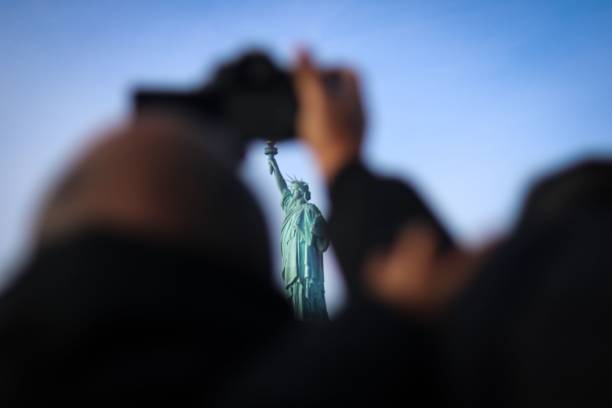 istock The Statue of Liberty framed by a tourist. 1469971999