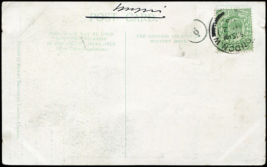 a vintage blank postcard sent from London, UK in 1900s,  ready for any usage of  historic events background related to mail delievery description.