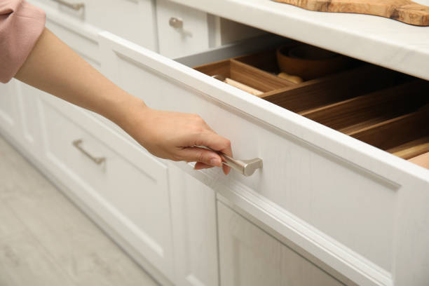 istock Woman opening drawer in kitchen, closeup view 1469972843