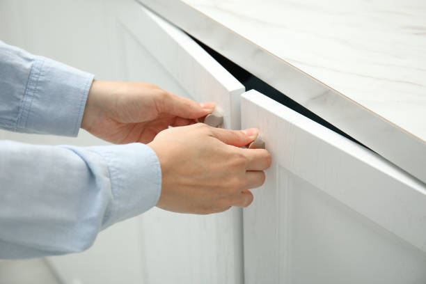 istock Woman opening cabinet doors at home, closeup 1469972904