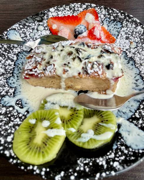 istock Dessert, Banana currant cake with vanilla sauce and fresh fruit 1469972923