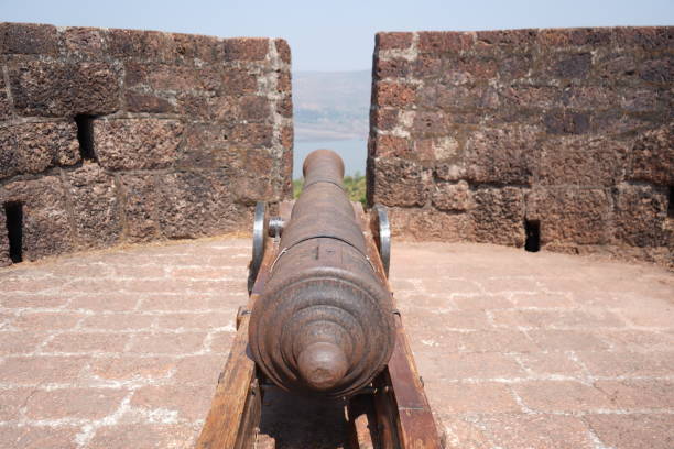 istock Old artillery canon facing sea 1469973981