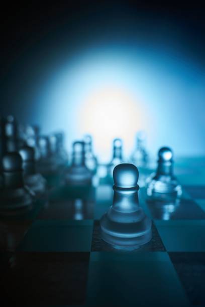 istock Chess board and chess figures with a focus on the pawn in extreme close-up. 1469978820