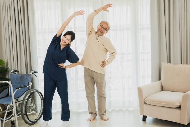 istock Nurse look after elderly patient exercising 1469979725