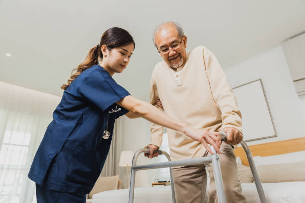 istock Elderly patient physiotherapy nurse exercising and try to walk 1469979742