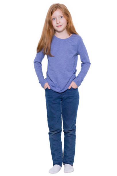 istock Redhead girl standing with her hands in her pockets 1469979935