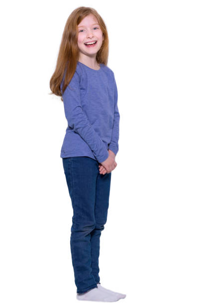 istock Redhead girl standing with her hands clasped in front 1469980064