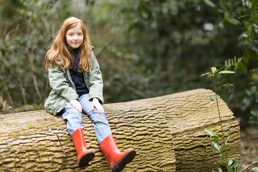 Redhead aged 8 exploring in the countryside.