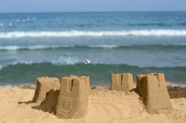 istock Beautiful sand castle on beach near sea 1469982052