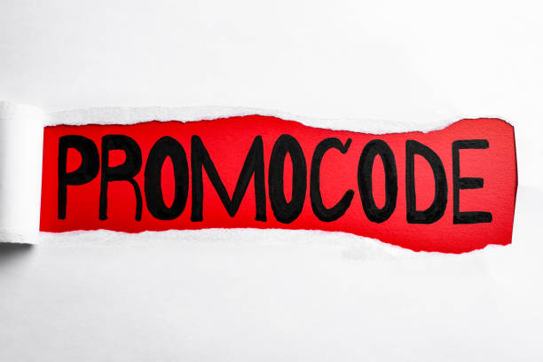 istock Word Promocode written on red background, view through hole in white paper 1469982282