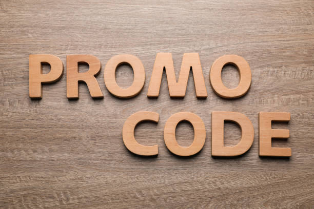 istock Words Promo Code made of letters on wooden table, flat lay 1469982393