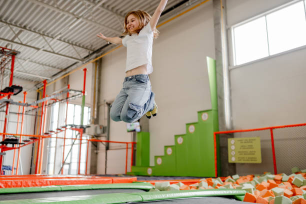 istock Pretty girl in trampoline park having fun 1469983931