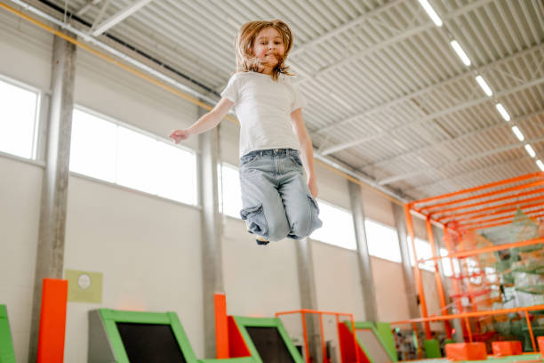 istock Pretty girl in trampoline park having fun 1469983953