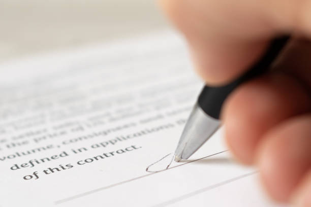 istock The employee signs the contract. Close-up 1469984168