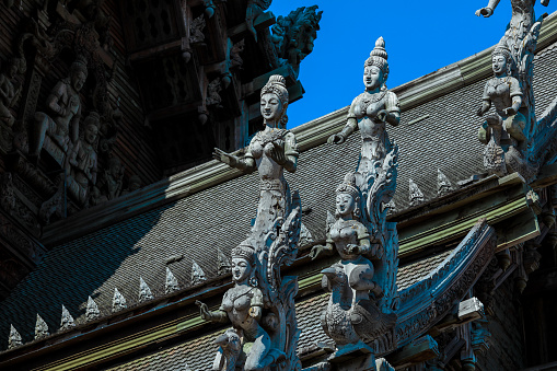 Wooden Curved Statues and Details of the Roof in the Sanctuary of Truth in Pattaya, Thailand