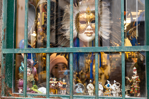 Venetian masks in store display in Venice, Italy.