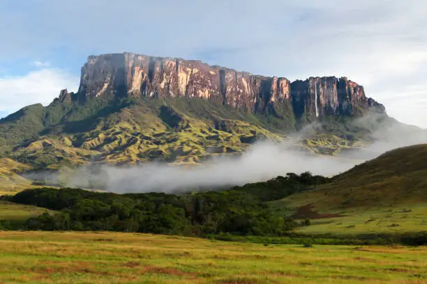 Scenic view of Kukenan tepui against sky with valley in foreground, Mount Roraima, Roraima, Bolivar State, Venezuela.