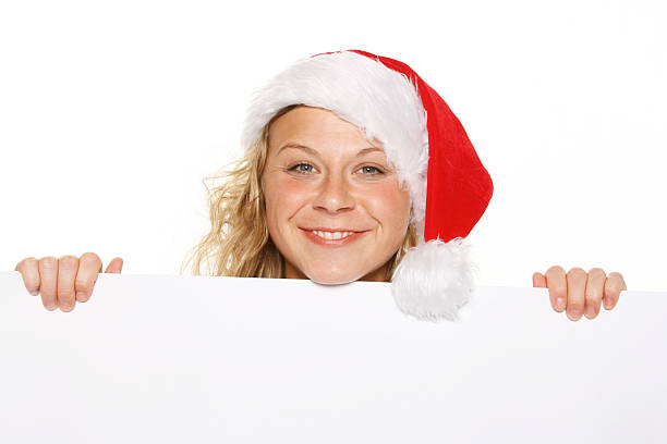 istock Young woman with Santa hat and white board 146998942