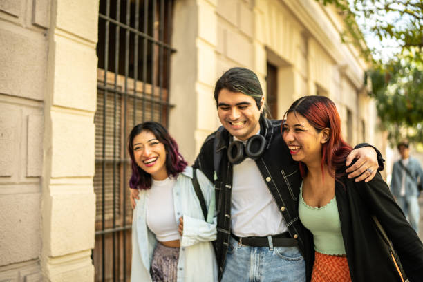 istock Friends having fun while walking through the city 1469990456