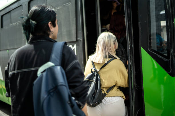 istock Young woman getting on the bus 1469992291