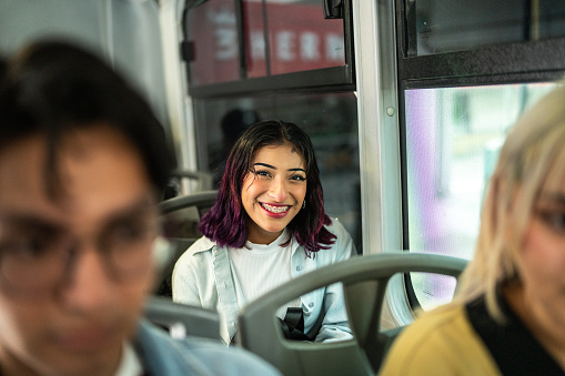 Portrait of a young woman on a bus